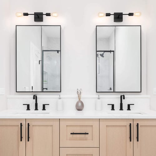 Two mirrors make this modern bathroom more functional and stylish.