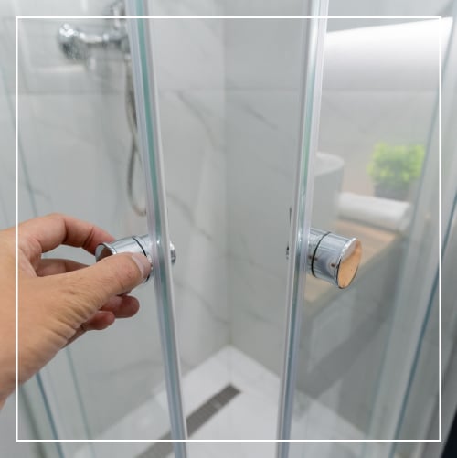 Open glass shower door.