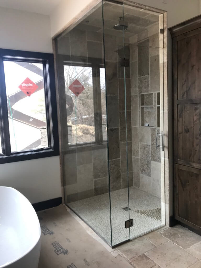 Glass shower enclosure