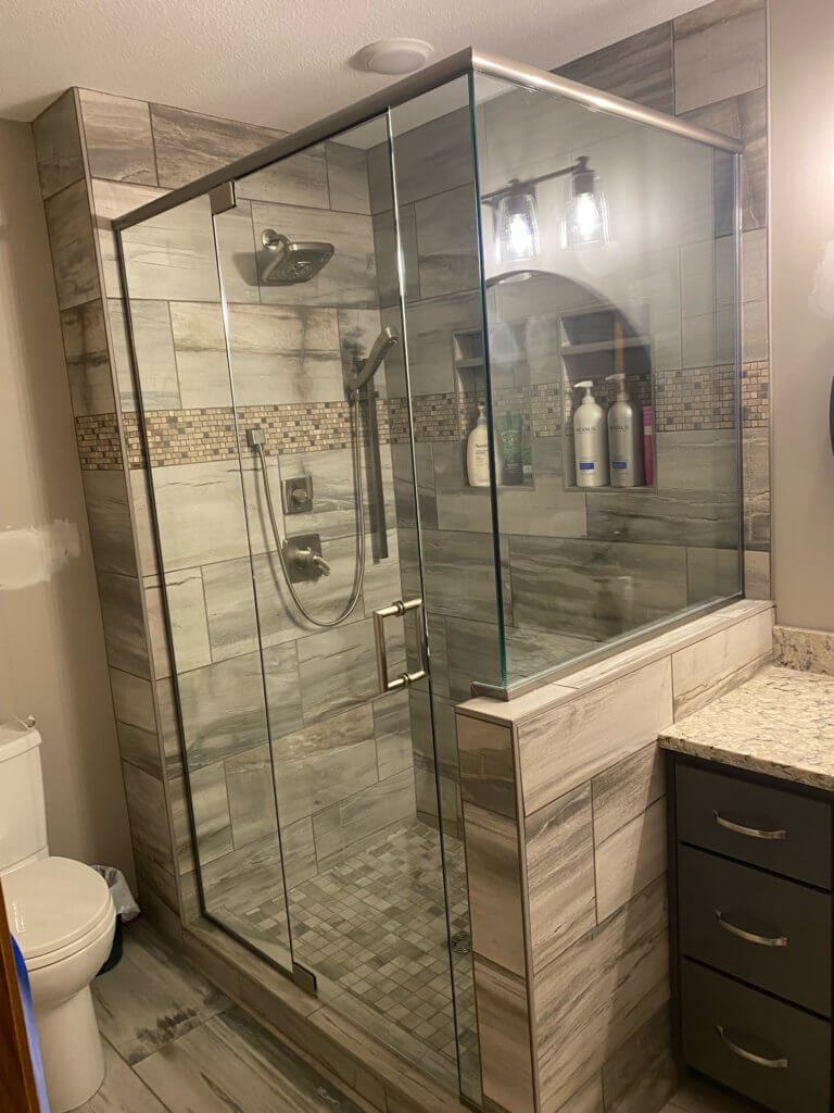 Glass shower enclosure
