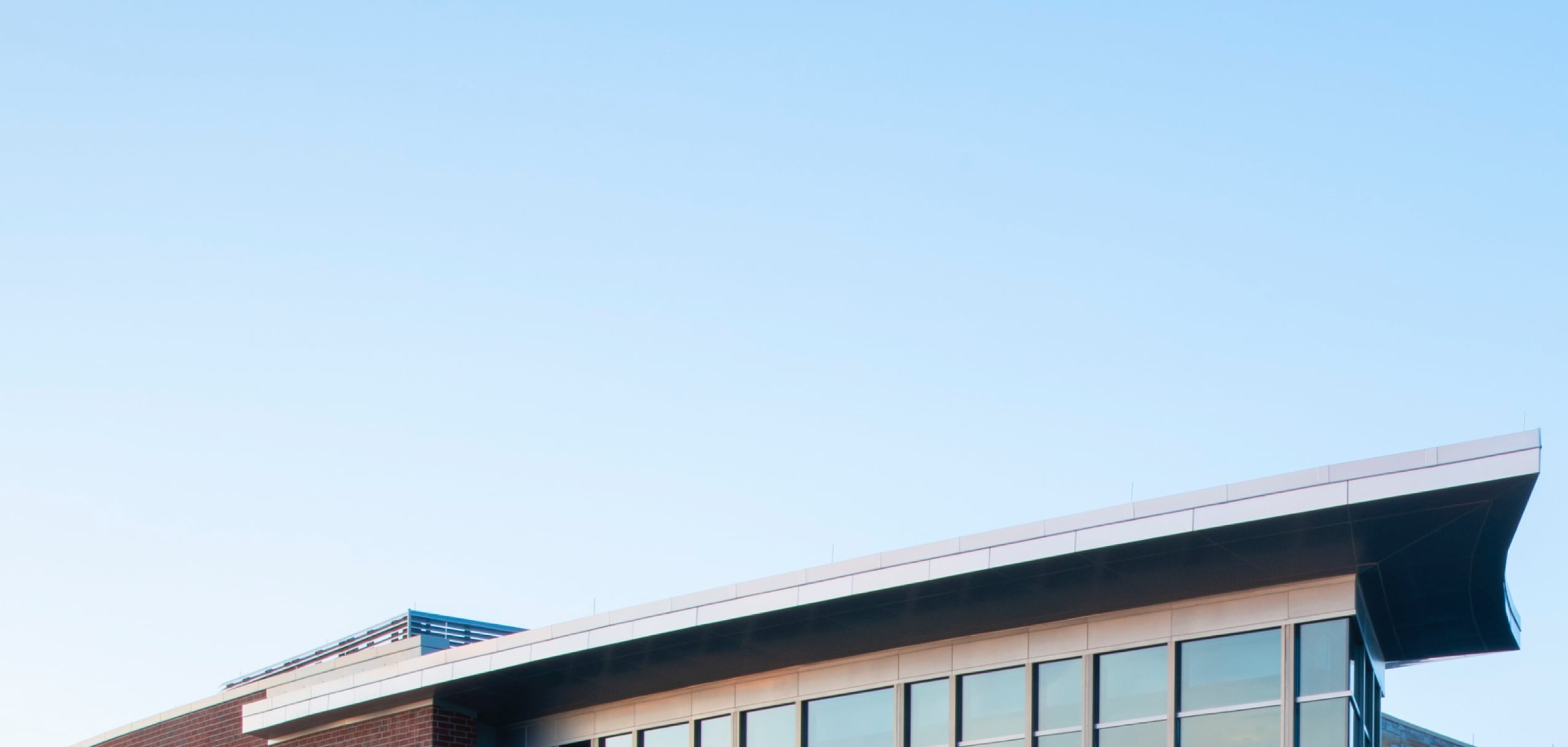 glass windows on building with blue sky background