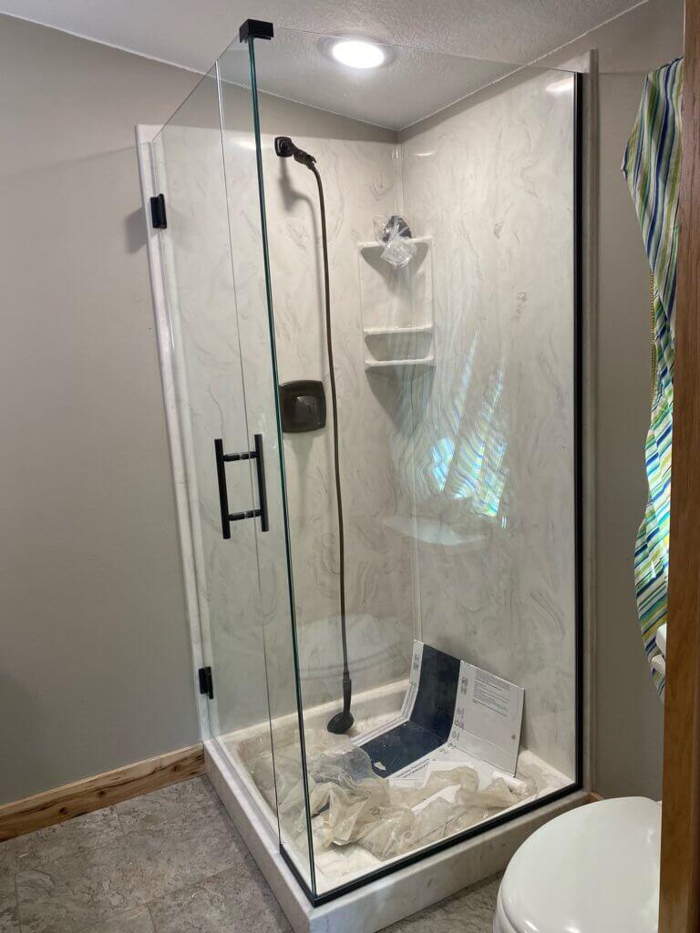 Glass shower enclosure