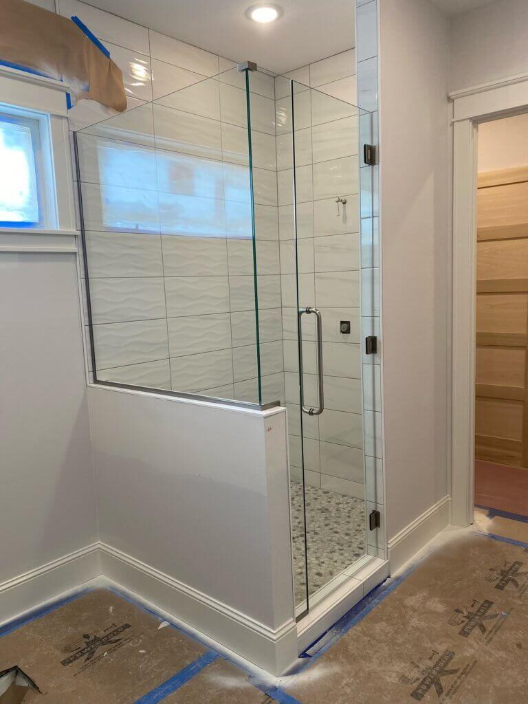 Glass shower enclosure