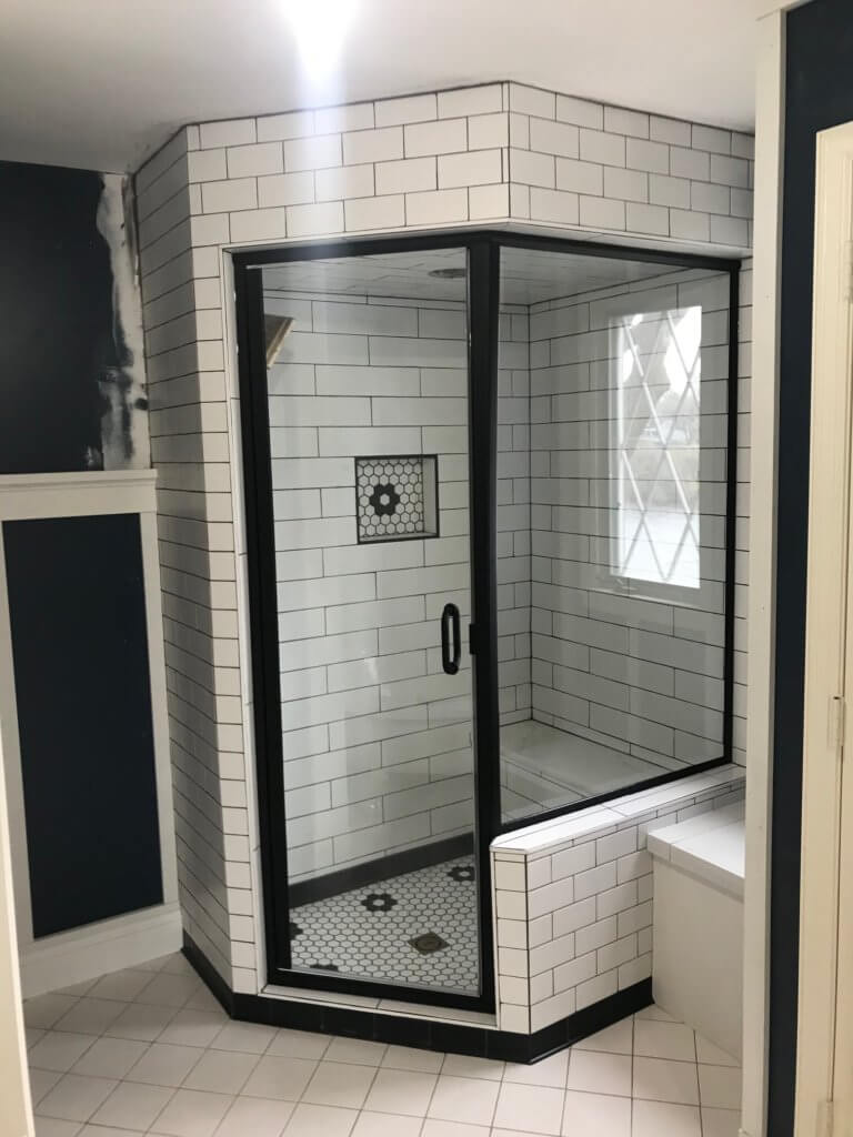 Glass shower enclosure