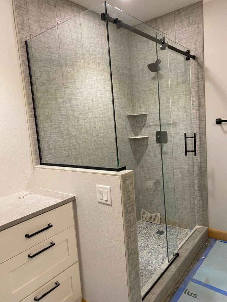 Glass shower enclosure