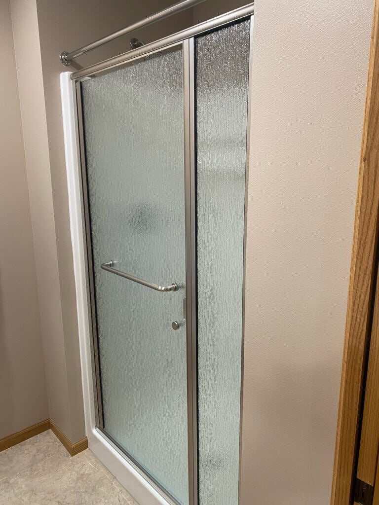 Patterned glass shower door